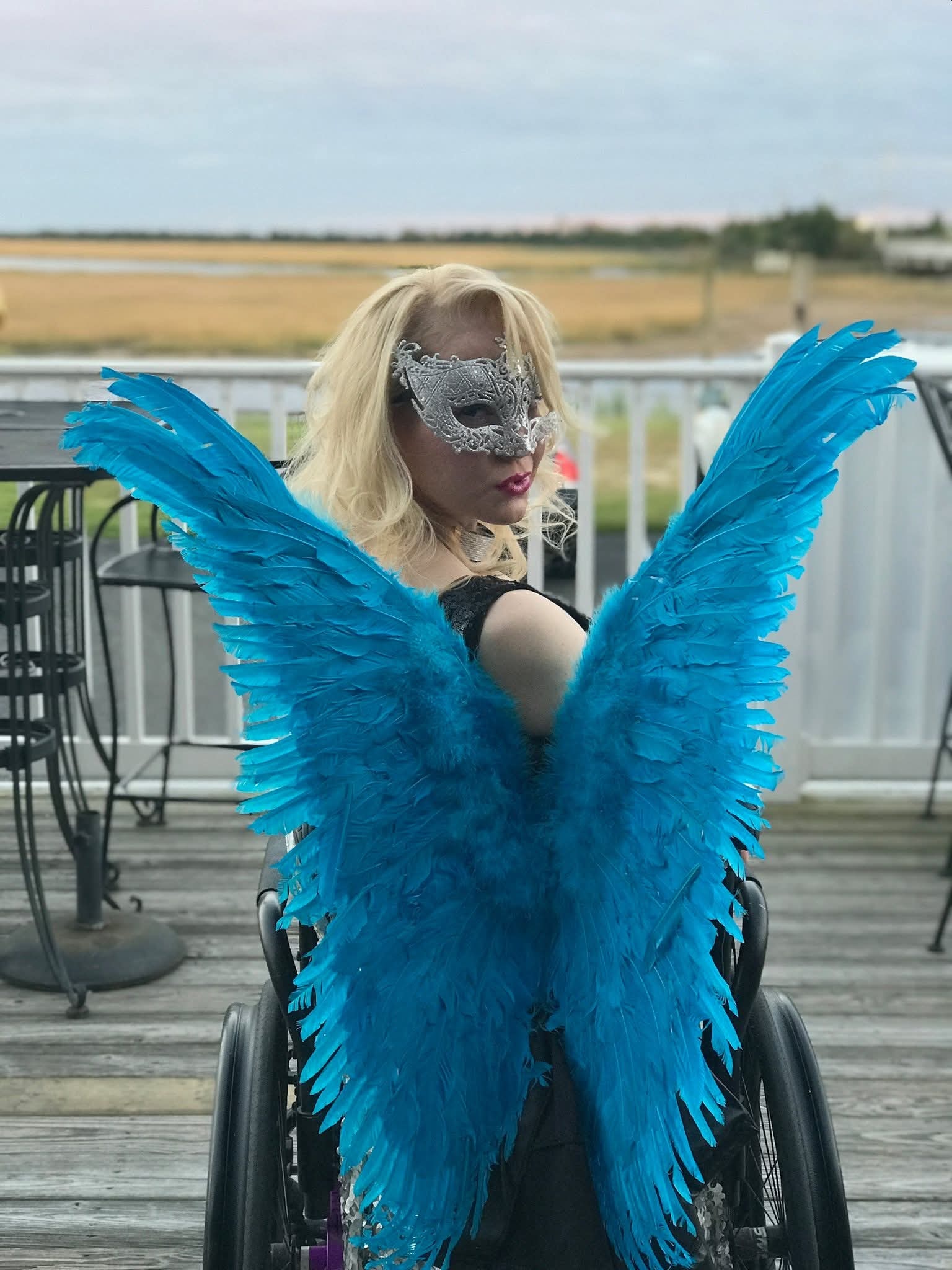 Masquerade — community member in costume