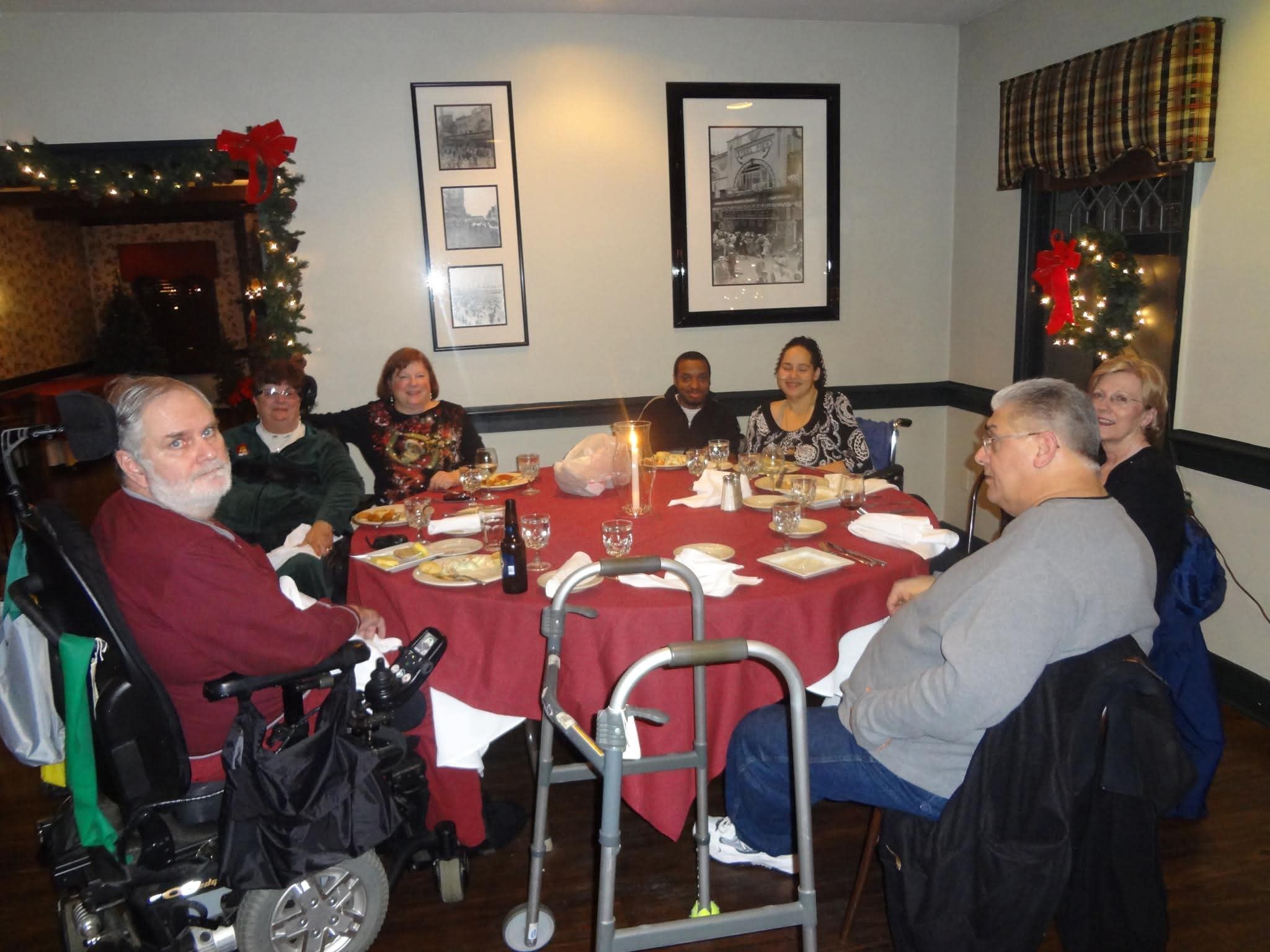 Holiday dinner — members smiling together