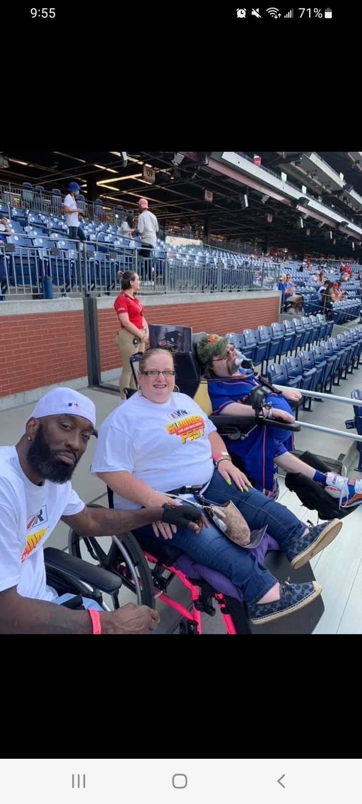 Community members at a baseball game outing