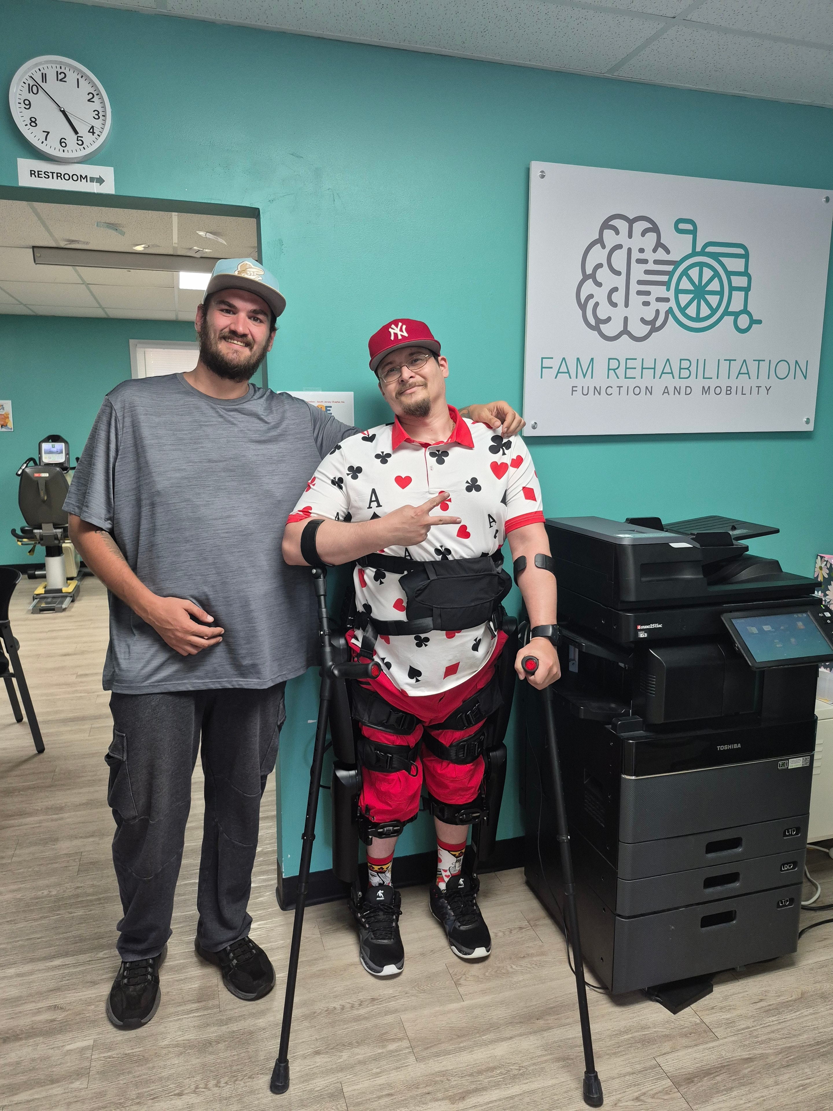 Two members at teal-wall community venue
